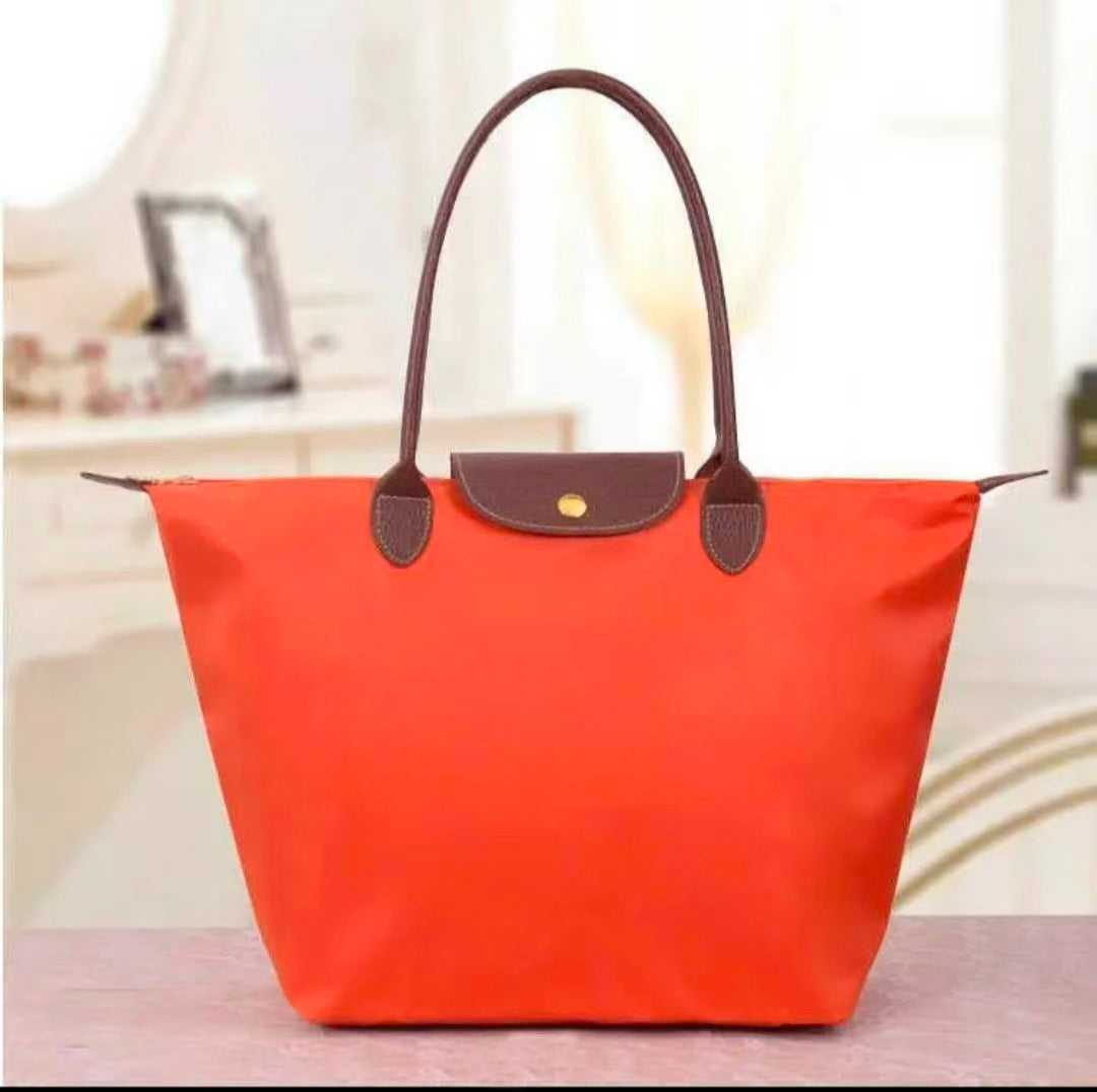 Longchamp - Small Le Pliage Handbag, Orange